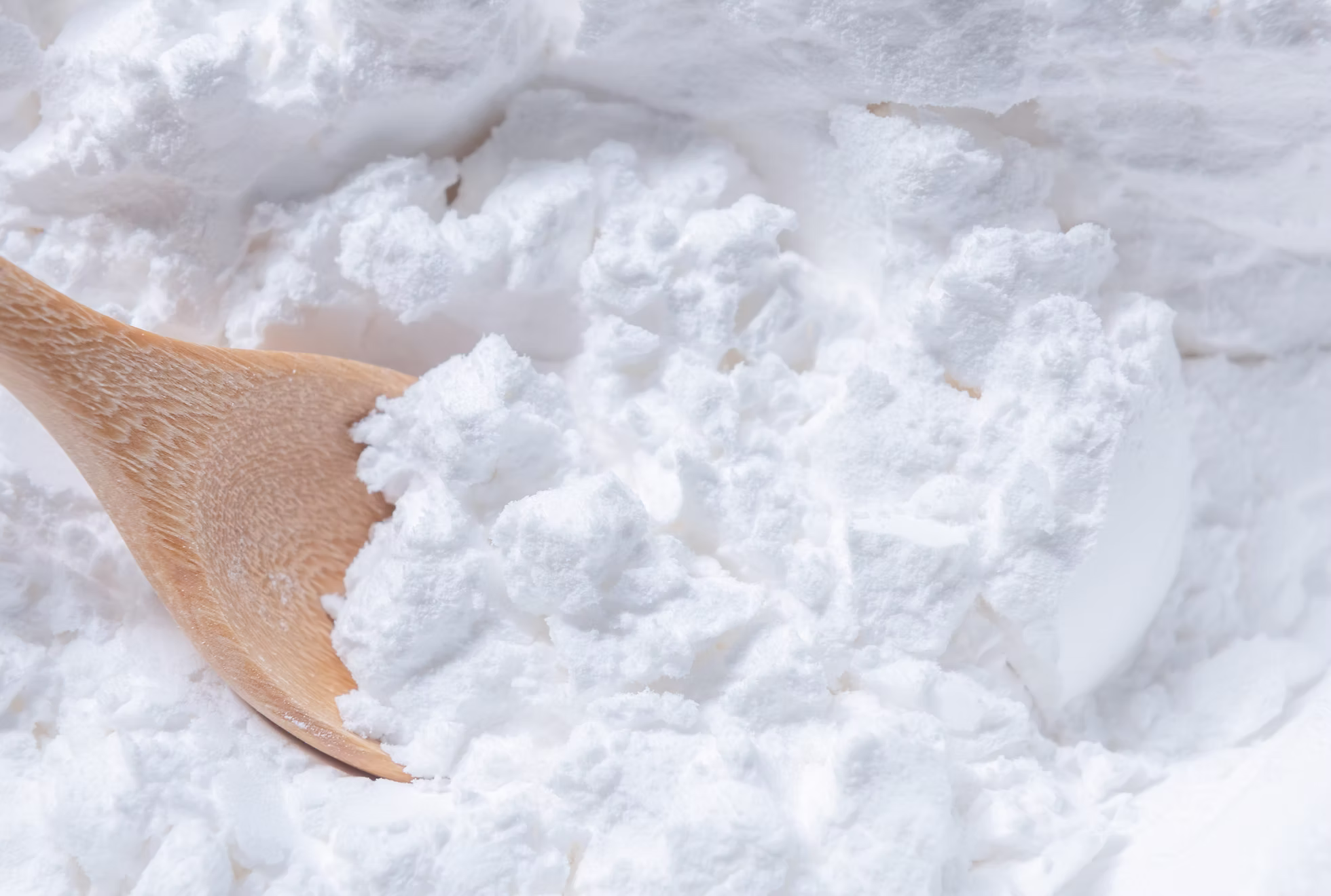 Native tapioca starch — bright white fine powder with wooden scoop